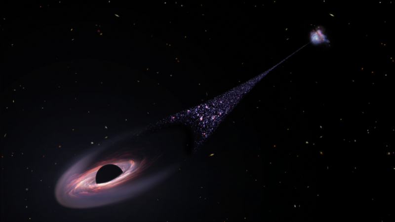 Black hole is soaring between galaxies, leaving stars in its wake